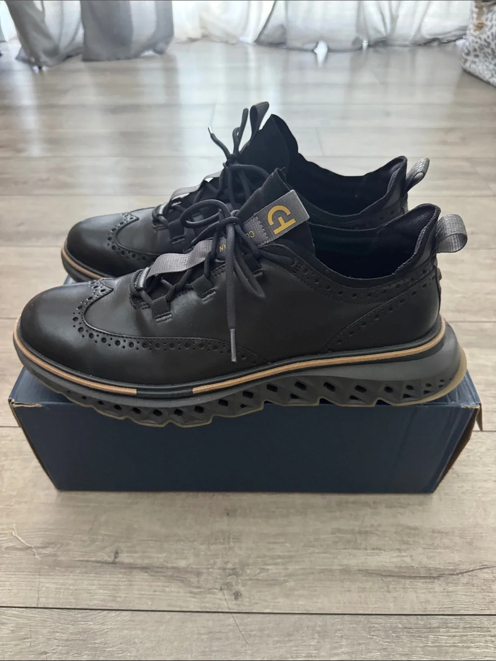 Cole Haan Black Leather Wingtip Derbys with Tan Outsole